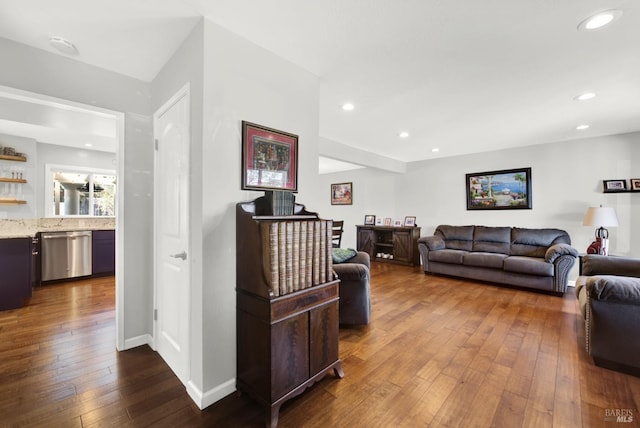 living room with dark hardwood / wood-style flooring