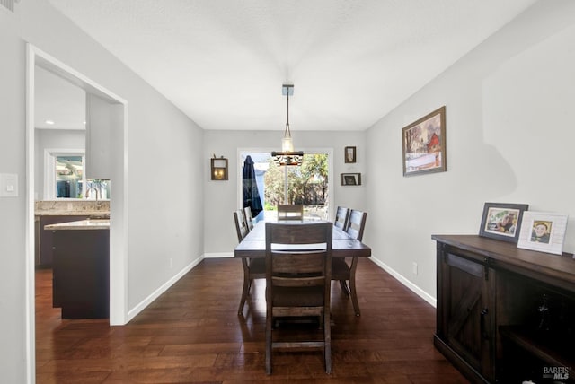 dining area featuring dark wood-type flooring