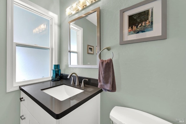 bathroom with vanity and toilet