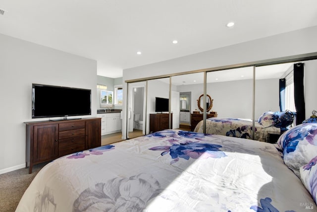 carpeted bedroom with a closet