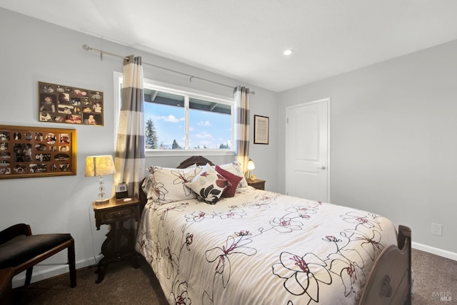 bedroom with dark carpet