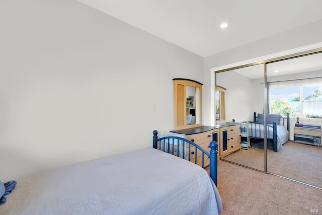 carpeted bedroom featuring a closet