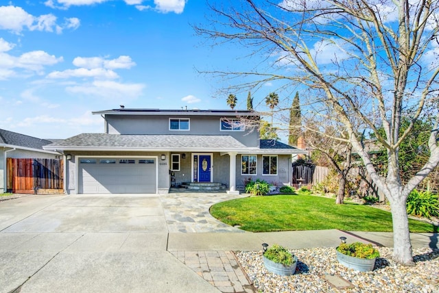 front of property featuring a garage and a front yard