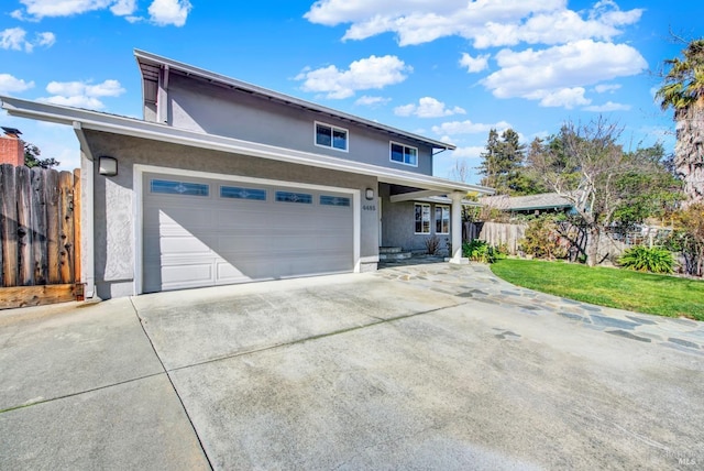 view of front property with a garage and a front lawn