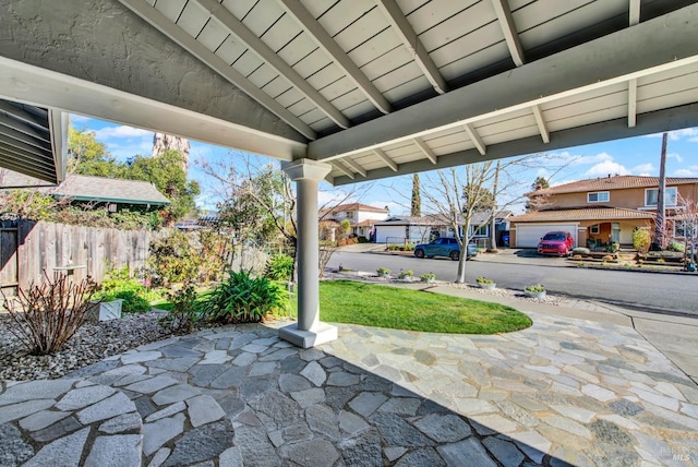 view of patio / terrace featuring a garage