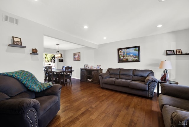 living room with dark hardwood / wood-style floors