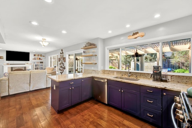 kitchen featuring dishwasher, sink, dark hardwood / wood-style flooring, light stone counters, and kitchen peninsula