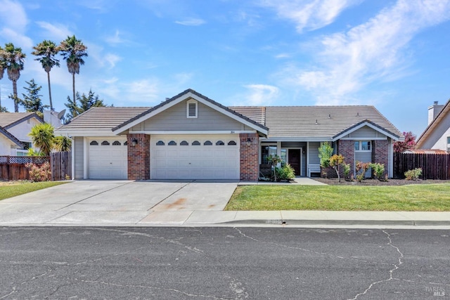 ranch-style house with a garage and a front yard