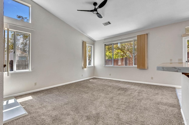 interior space with ceiling fan, high vaulted ceiling, and carpet