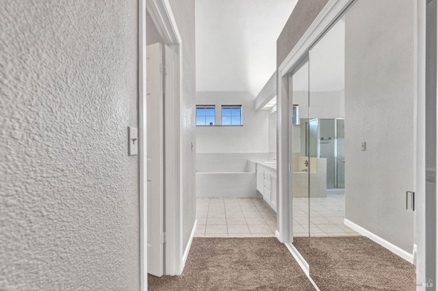 bathroom featuring tile patterned flooring, vanity, and independent shower and bath