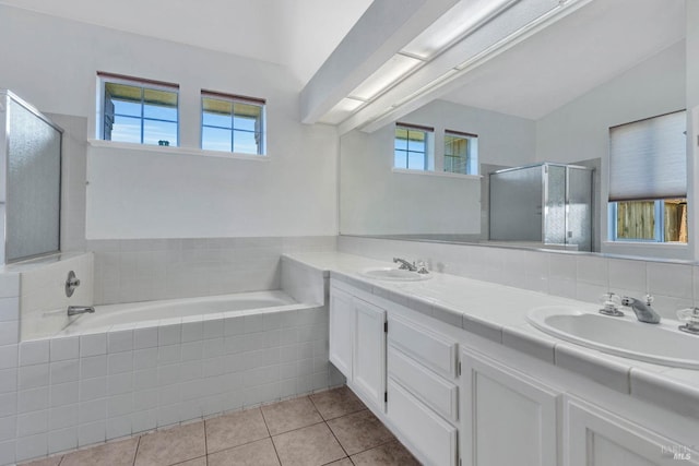 bathroom with tile patterned flooring, vanity, and independent shower and bath