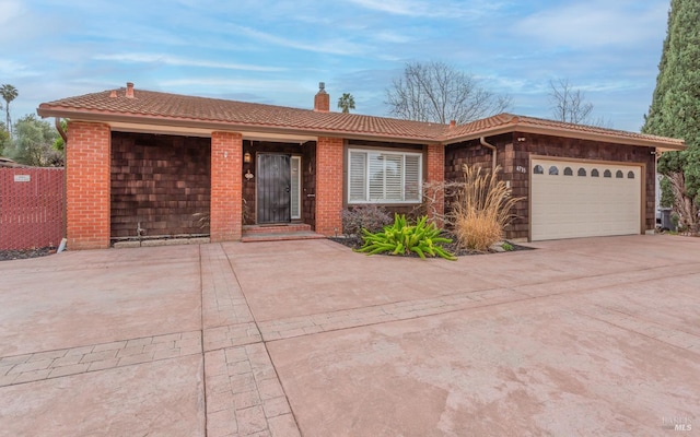 single story home featuring a garage