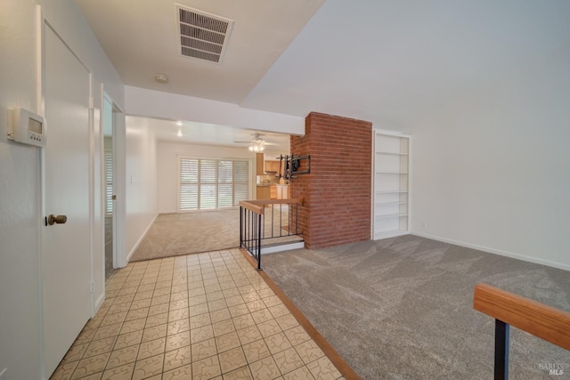 interior space featuring light carpet and built in features