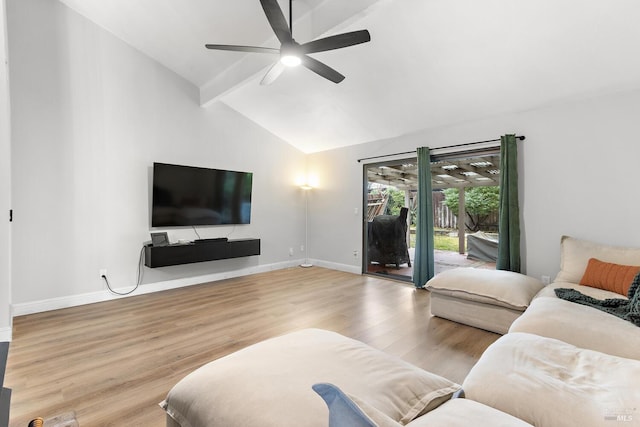 living room featuring lofted ceiling with beams, light hardwood / wood-style floors, and ceiling fan