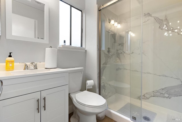 bathroom with vanity, toilet, and walk in shower