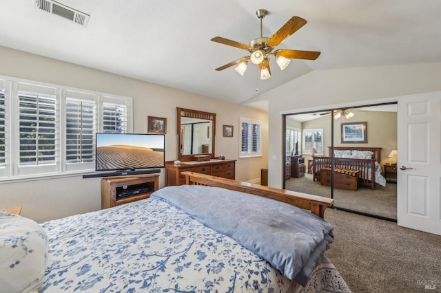 bedroom with vaulted ceiling, carpet, ceiling fan, and a closet