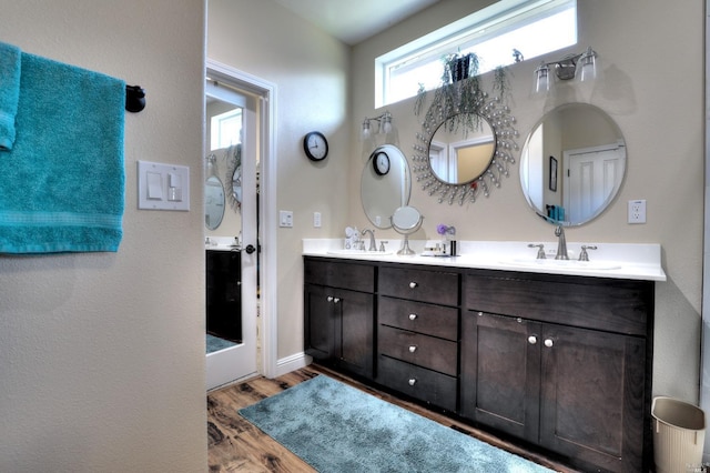 bathroom featuring vanity and hardwood / wood-style floors