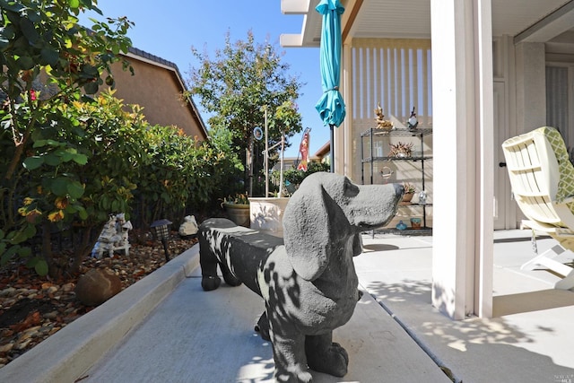 view of home's community featuring a patio area