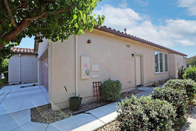 view of home's exterior with a garage