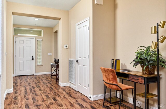 foyer entrance with dark hardwood / wood-style flooring