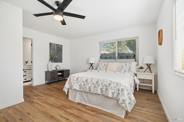 bedroom with light hardwood / wood-style flooring and ceiling fan