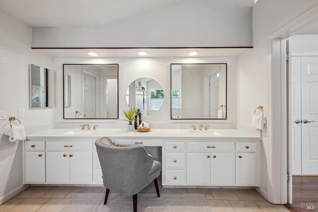 full bathroom featuring recessed lighting, lofted ceiling, vanity, and tile patterned flooring