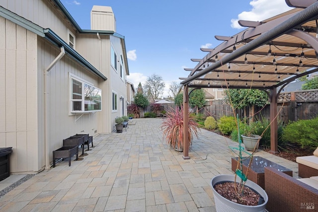 view of patio with a fenced backyard and a pergola