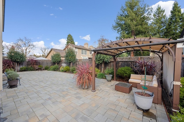 view of patio / terrace with a fenced backyard and a pergola