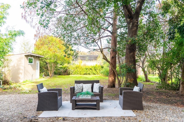 view of patio / terrace with an outbuilding and an outdoor living space