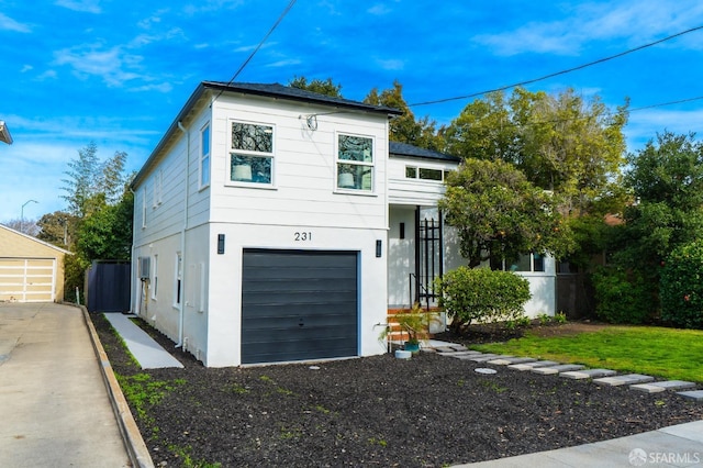 view of front of house with fence and stucco siding