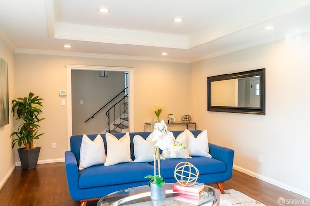 living room with recessed lighting, a raised ceiling, stairway, wood finished floors, and baseboards