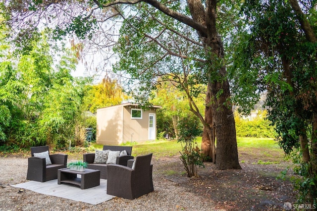 view of patio / terrace featuring an outbuilding and outdoor lounge area