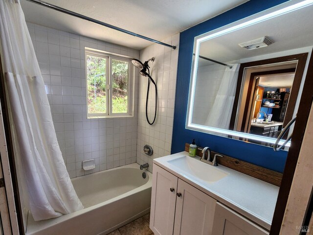 bathroom featuring vanity and a shower stall