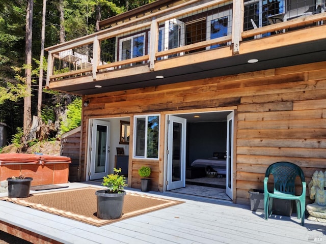 deck with a hot tub