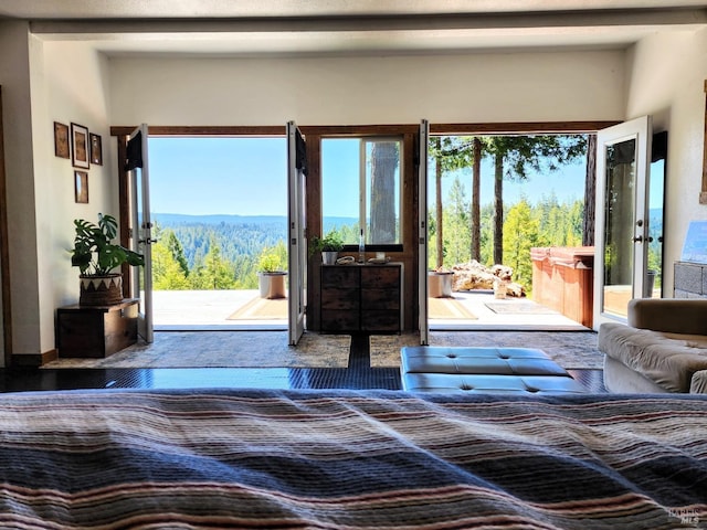 doorway to outside featuring a wooded view