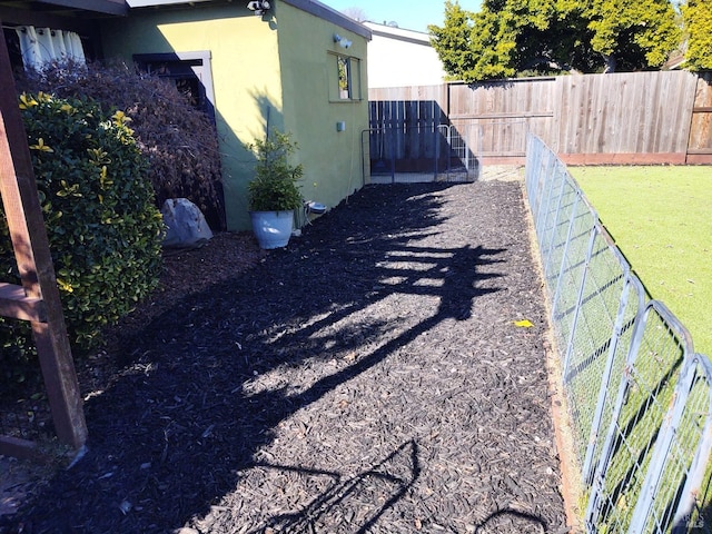 exterior space featuring a fenced backyard