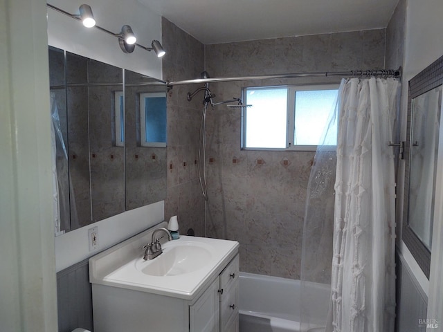 bathroom with shower / bath combination with curtain and vanity