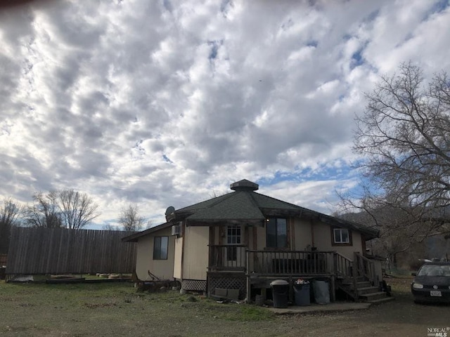 view of front of property with a wooden deck