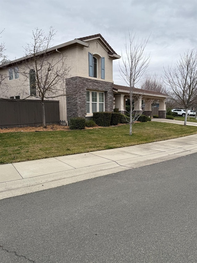 traditional-style house with stone siding, a front lawn, and stucco siding