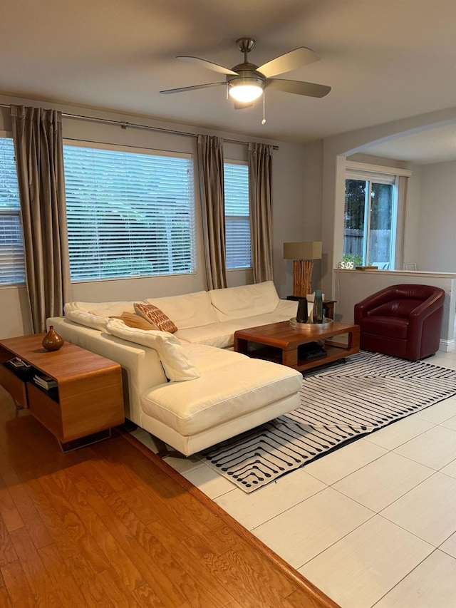 living room with a ceiling fan and wood finished floors