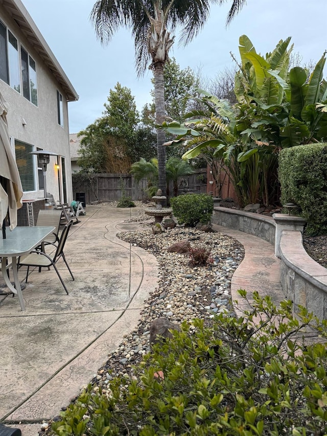 view of yard featuring a patio area and fence