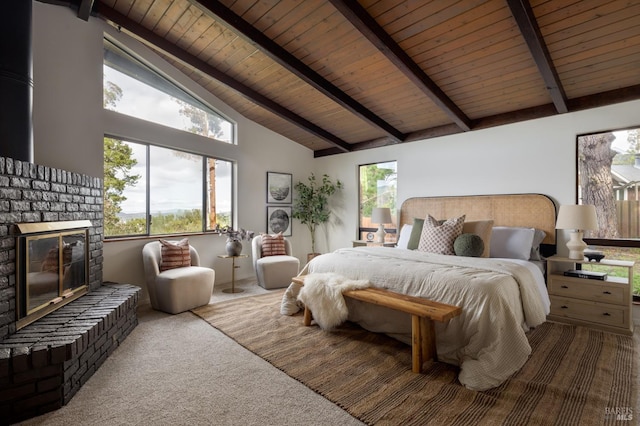 carpeted bedroom with beamed ceiling, wood ceiling, a fireplace, and high vaulted ceiling