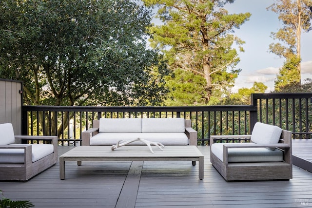 wooden deck with an outdoor living space