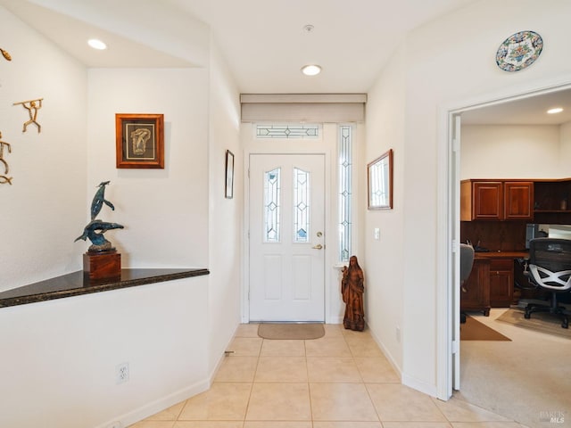 foyer entrance featuring light tile patterned flooring