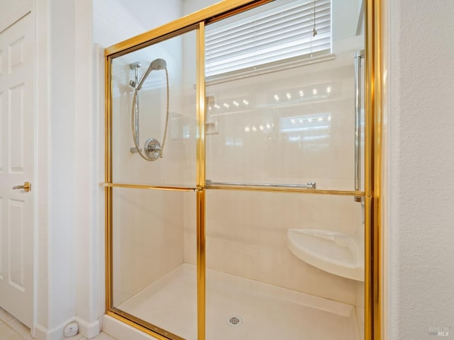 bathroom featuring an enclosed shower