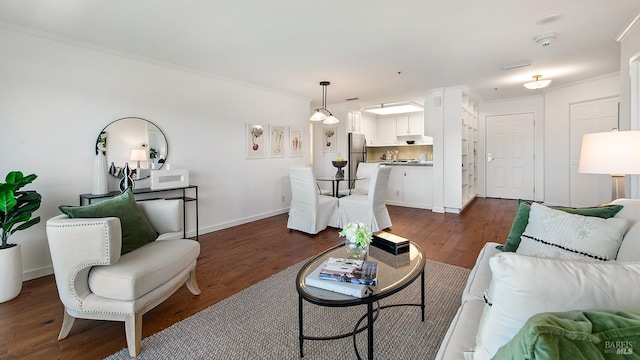 living room featuring crown molding and dark hardwood / wood-style flooring