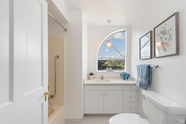 full bathroom with shower / tub combination, vanity, toilet, and tile patterned floors