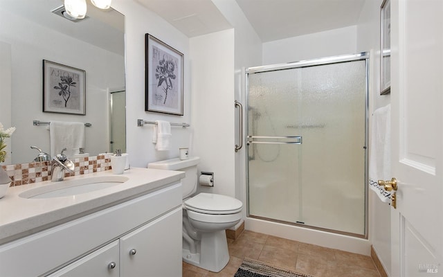 bathroom featuring an enclosed shower, vanity, tile patterned flooring, and tasteful backsplash