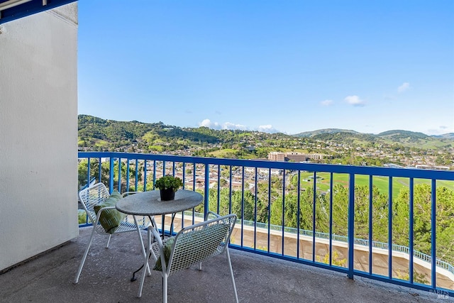 balcony featuring a mountain view