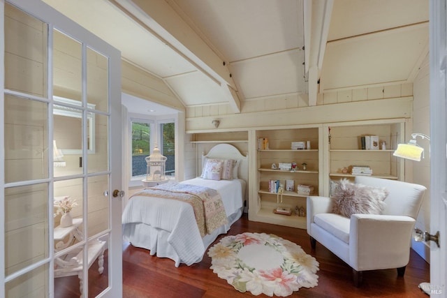 bedroom featuring dark hardwood / wood-style floors and beam ceiling